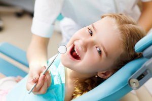 Little girl undergoing dental examination at Fair City Mall Dental Care, Fairfax, VA