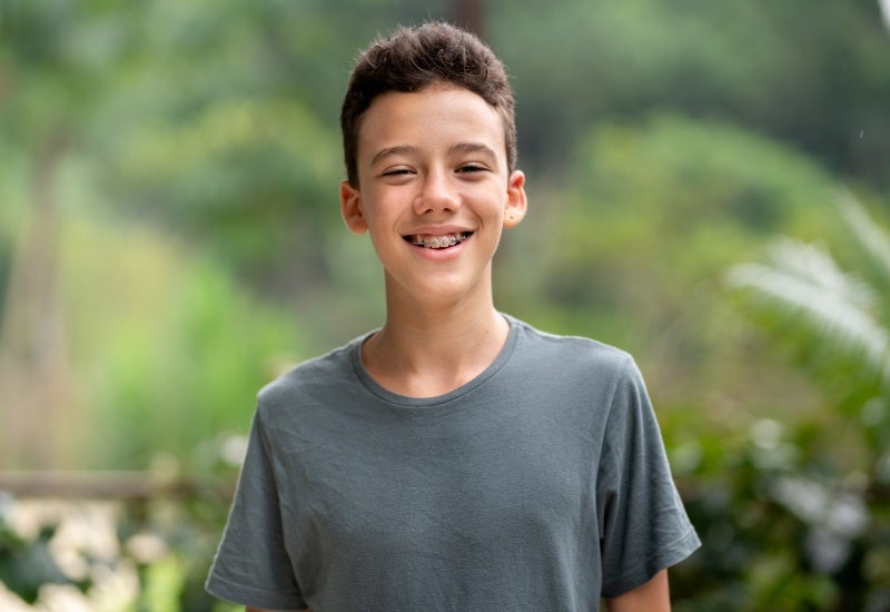 A young boy selects metal braces from the options available at Fair City Mall Dental Care in Fairfax
